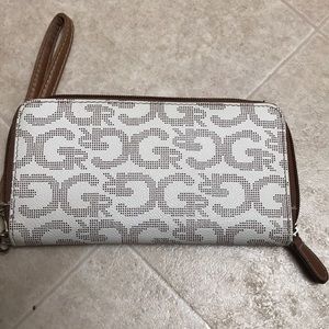 White and brown wallet.